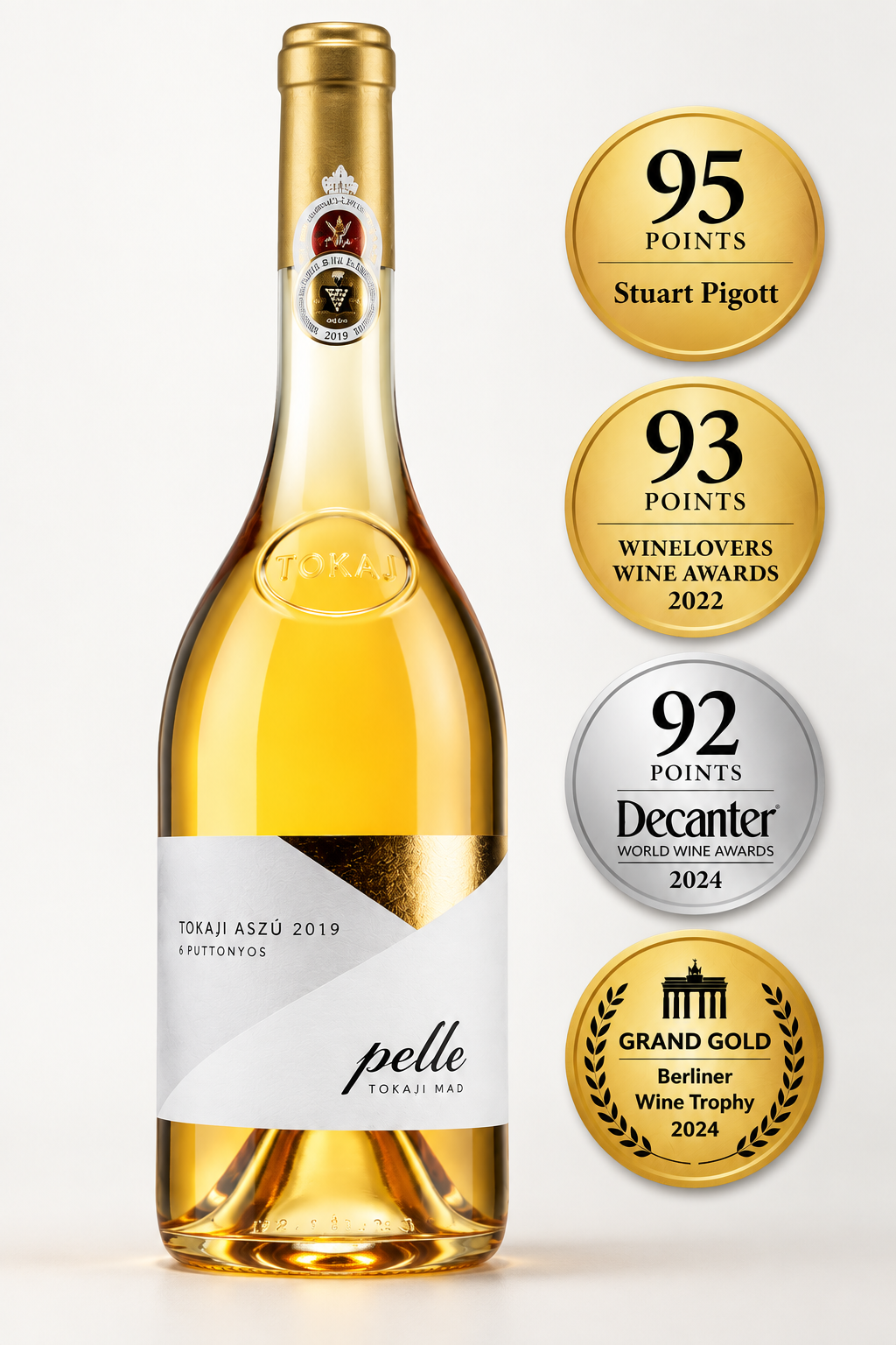 Tokai Aszu 2019 Pelle white wine bottle with a gold foil neck and a white and gold label, shown next to five award seals including Stuart Pigott, Winekeepers Wine Awards 2022, Decanter World Awards 2024, and Grand Gold Beer Festival Wine Awards 2024.