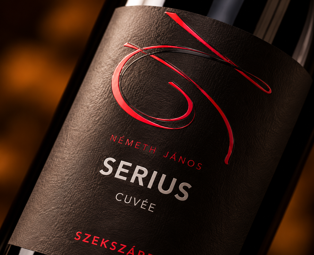 Close-up of Németh János SERIUS Cuvée wine label featuring elegant red lettering on textured black paper.